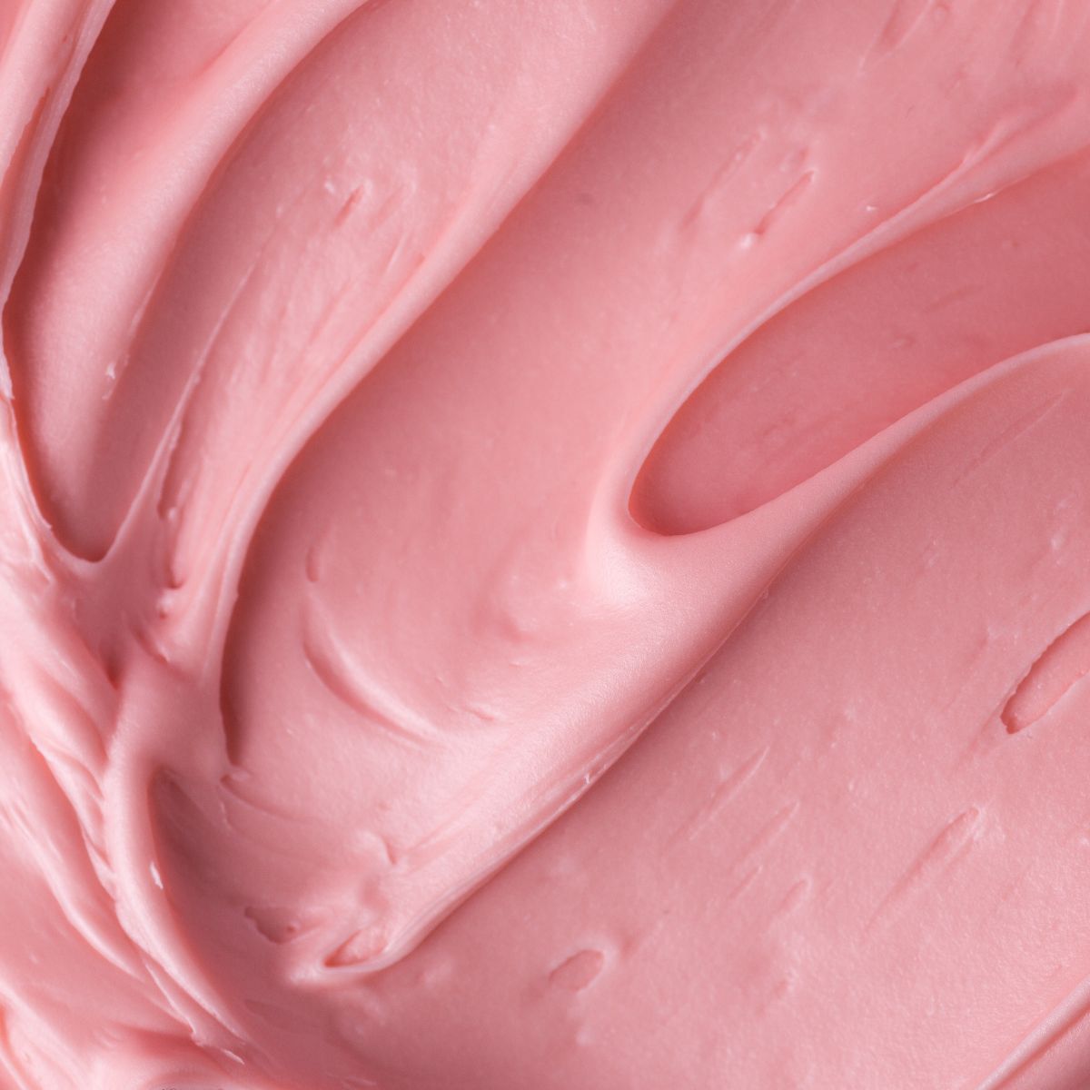 A close up of pink frosting in a mixing bowl: Signs you&#039;re eating too much sugar