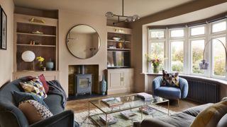 a taupe living room with built-in alcove storage