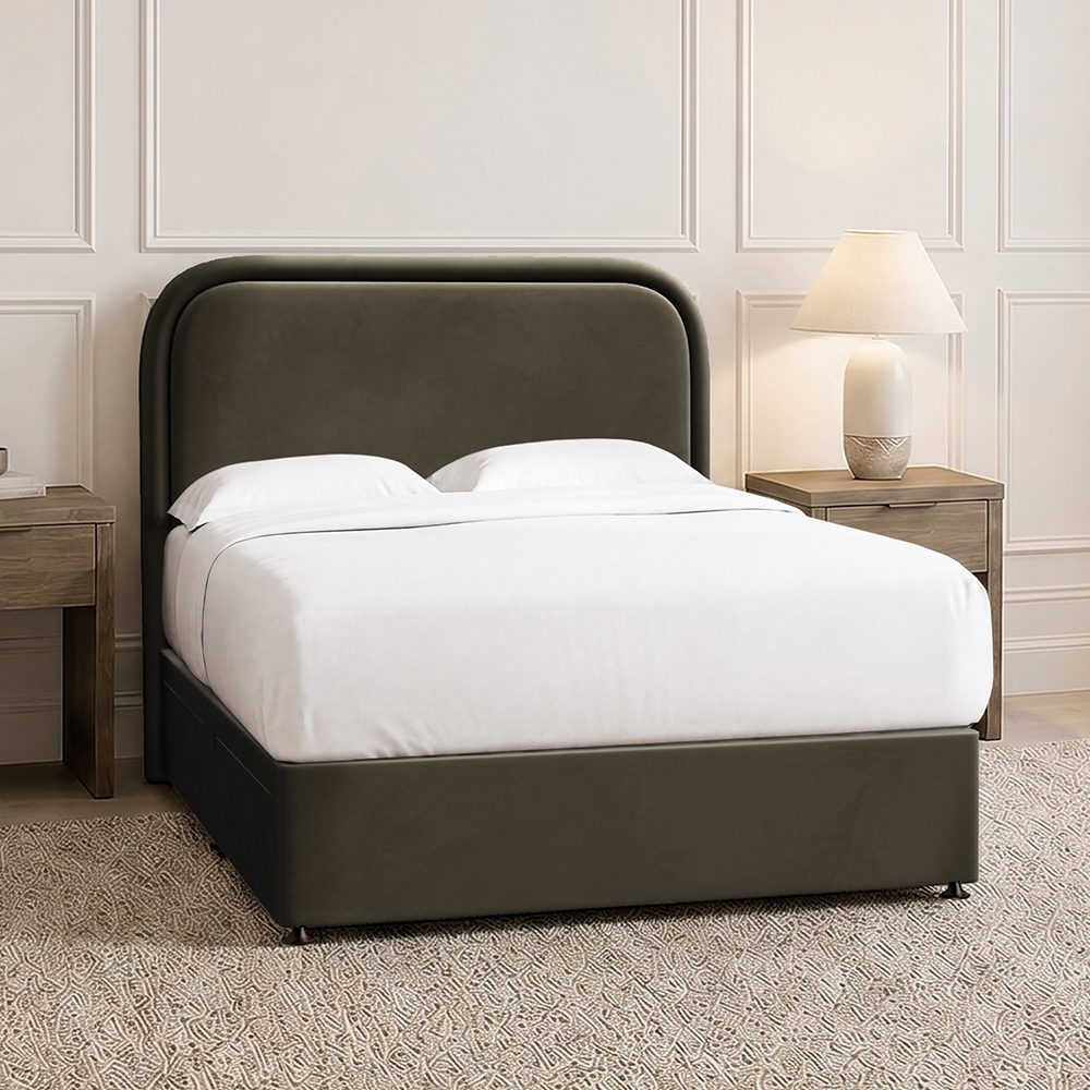 Olive green velvet upholstered bed in a cream bedroom