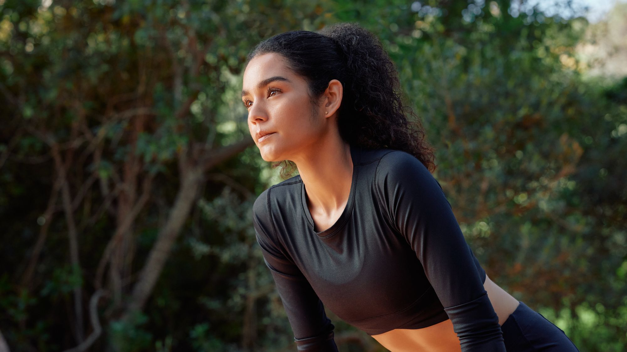 Downtime guilt: A woman resting after her workout but feeling guilty for doing so