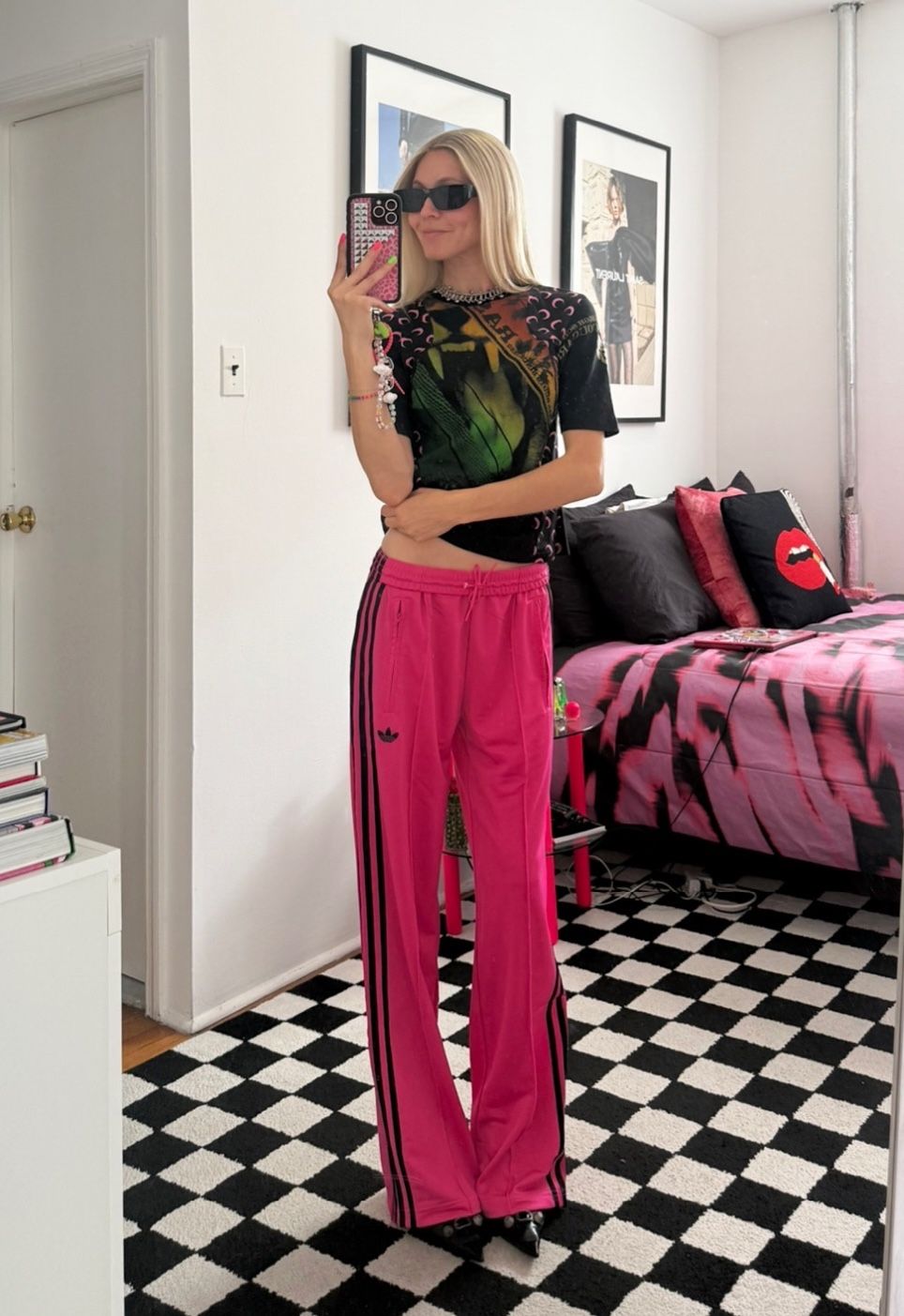 Jessica Minkoff posing in mirror wearing track pants