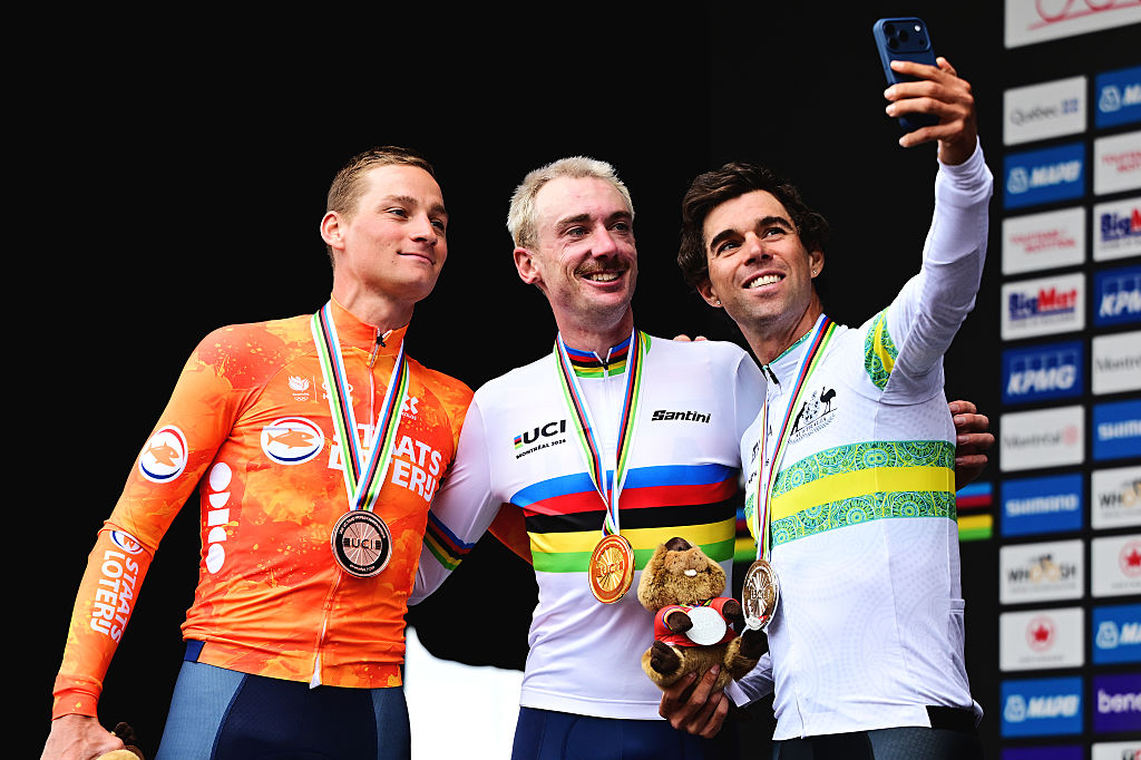 MONTREAL, QUEBEC - SEPTEMBER 27: (L-R) Bronze medalist Mathieu Van Der Poel and Team Netherlands, gold medalist Brandon McNulty and Team United States and silver medalist Michael Matthews and Team Australia pose on the podium for a selfie during the medal ceremony after the 99th UCI Road World Championships Montreal 2026 - Men Elite Road Race a 273.4km one day race from Brossard to Montreal on September 27, 2026 in Montreal, Quebec. (Photo by Tim de Waele/Getty Images)