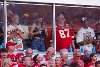 Taylor Swift flashes a thumbs up from her chiefs box