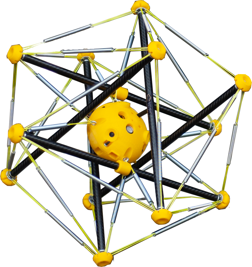 A close-up of the squishy robot, which looks like a yellow ball surrounded by many poles of a frame that forms a prism around the center.