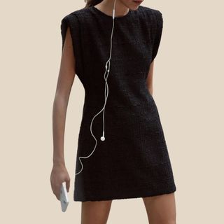 flat lay image of black mini dress