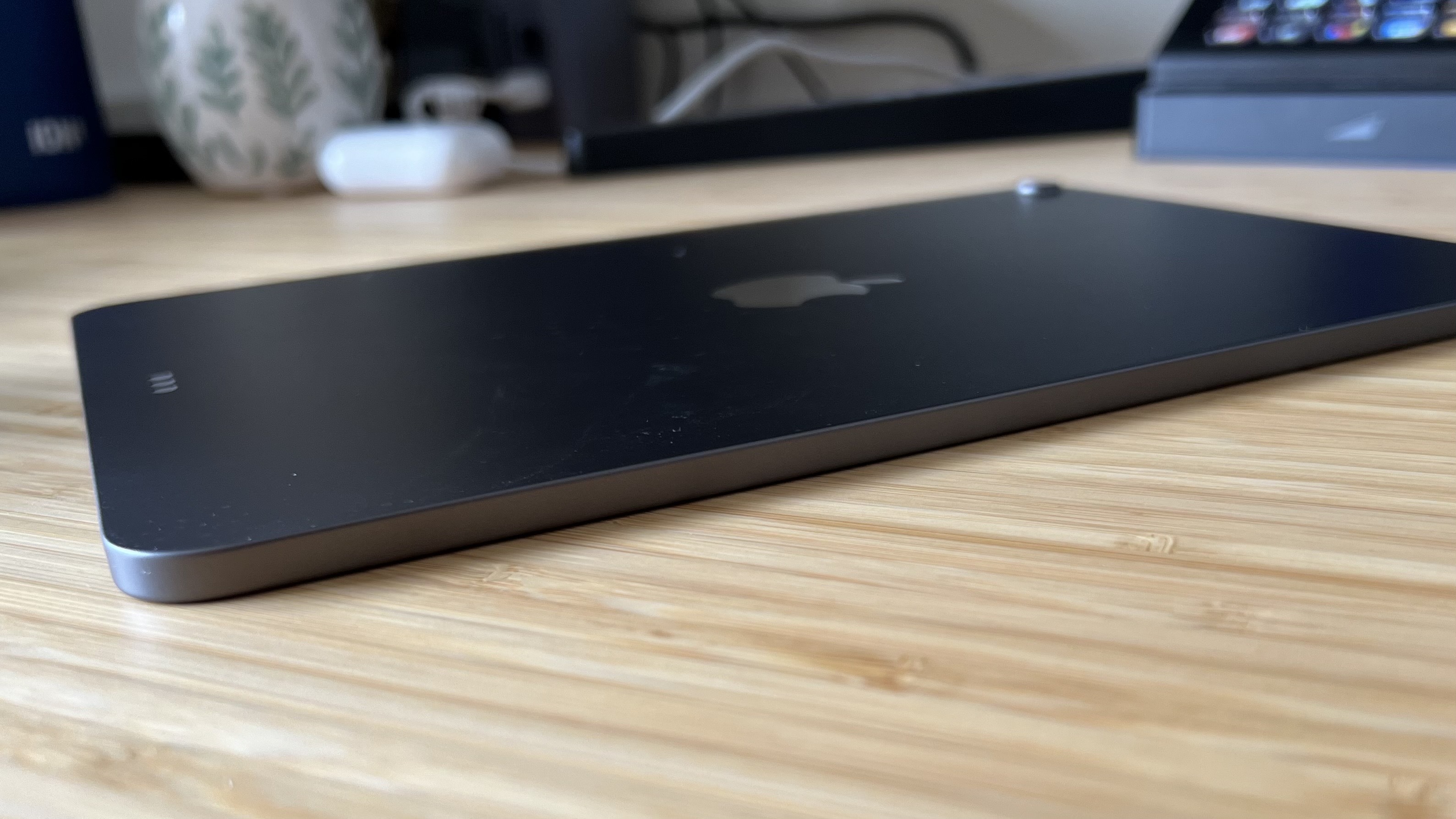 side of ipad air laying face down on a wooden table