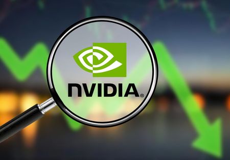 Concept image showing Nvidia shares falling on a chart behind a magnifying glass over the Nvidia logo in the foreground