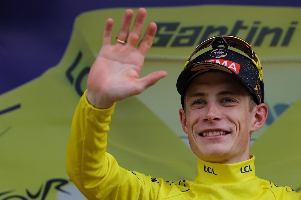 JumboVismas Danish rider Jonas Vingegaard celebrates on the podium with the overall leaders yellow jersey after the 8th stage of the 110th edition of the Tour de France cycling race 201 km between Libourne and Limoges in central western France on July 8 2023 Photo by Thomas SAMSON AFP Photo by THOMAS SAMSONAFP via Getty Images