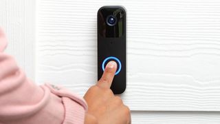 Blink Video Doorbell being press by woman