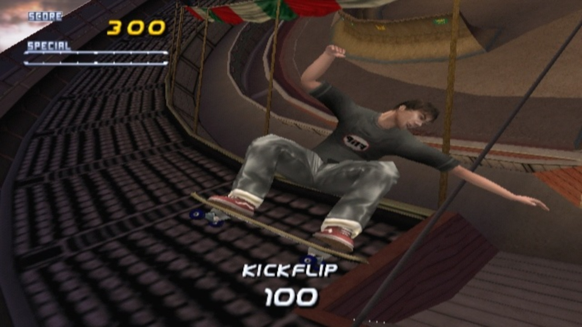 A skater performing a kick flip and earning 100 points in Tony Hawk's Pro Skater 2 on the PS1