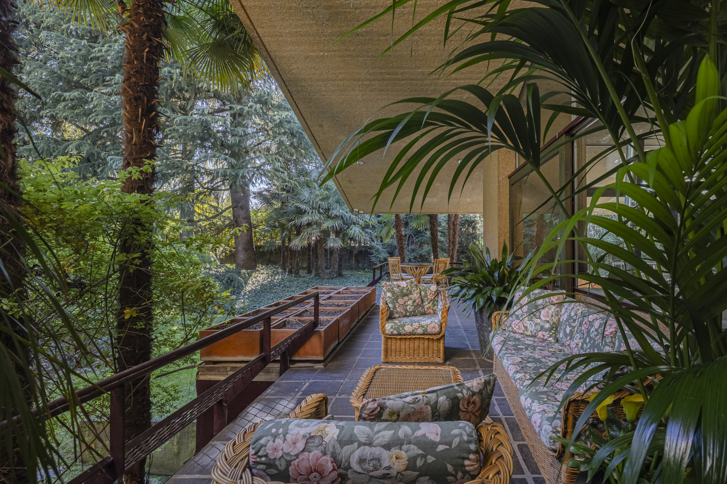 Covered loggias surround the house