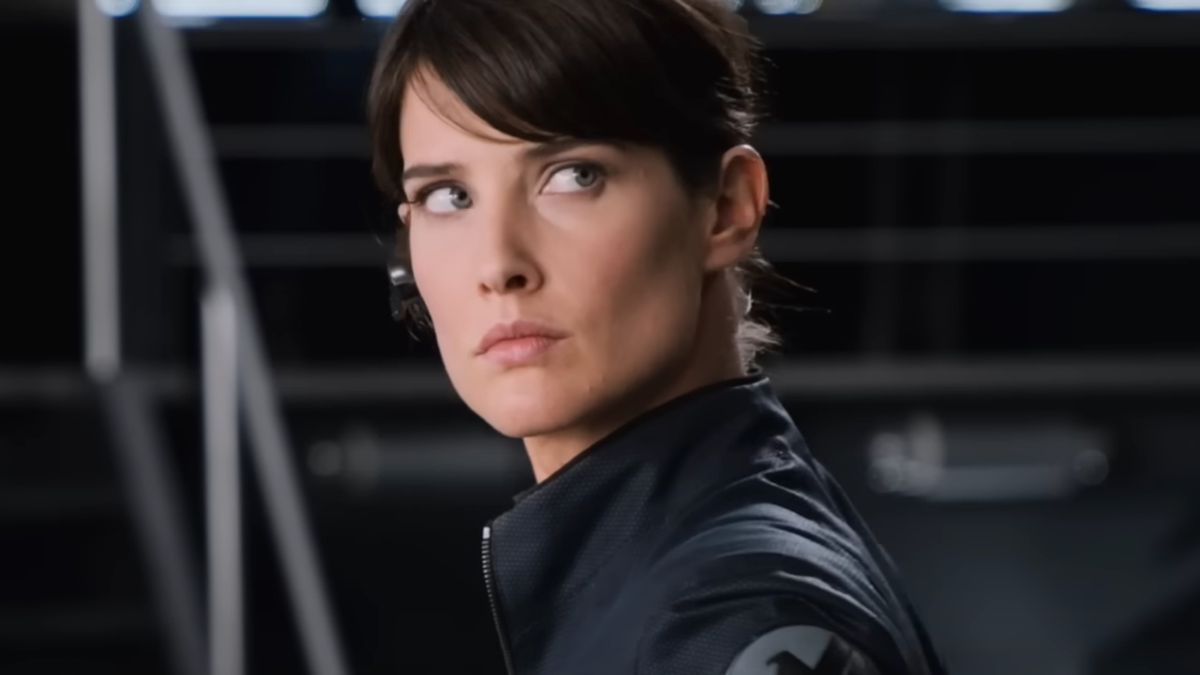 Cobie Smulders looking over her shoulder in uniform in The Avengers.