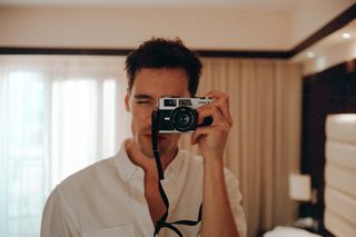 selfie in a mirror taken on the Canon Canonet G-III QL17