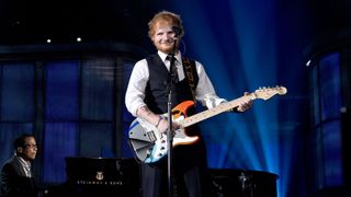 Ed Sheeran performs using his Crashocaster Fender Strat
