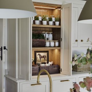 Shaker kitchen with open pantry with herb garden inside.