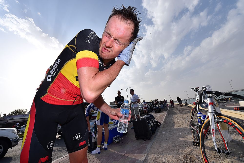 Belgian Champion Preben Van Hecke cleans himself off after the stage