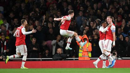 Arsenal captain Rob Holding (far right) celebrates his goal against Nottingham Forest 