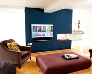TV and soundbar recessed on a living room wall