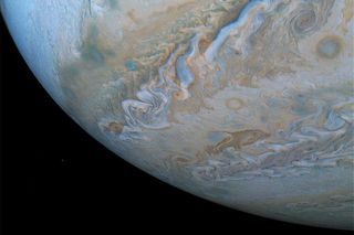 A dolphin-shaped cloud is visible in these Oct. 29 images of Jupiter's southern belt.