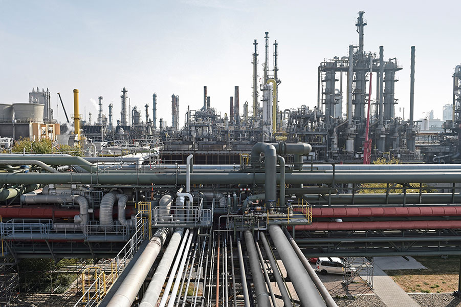 An ammonia production plant with lots of pipes running everywhere above ground.