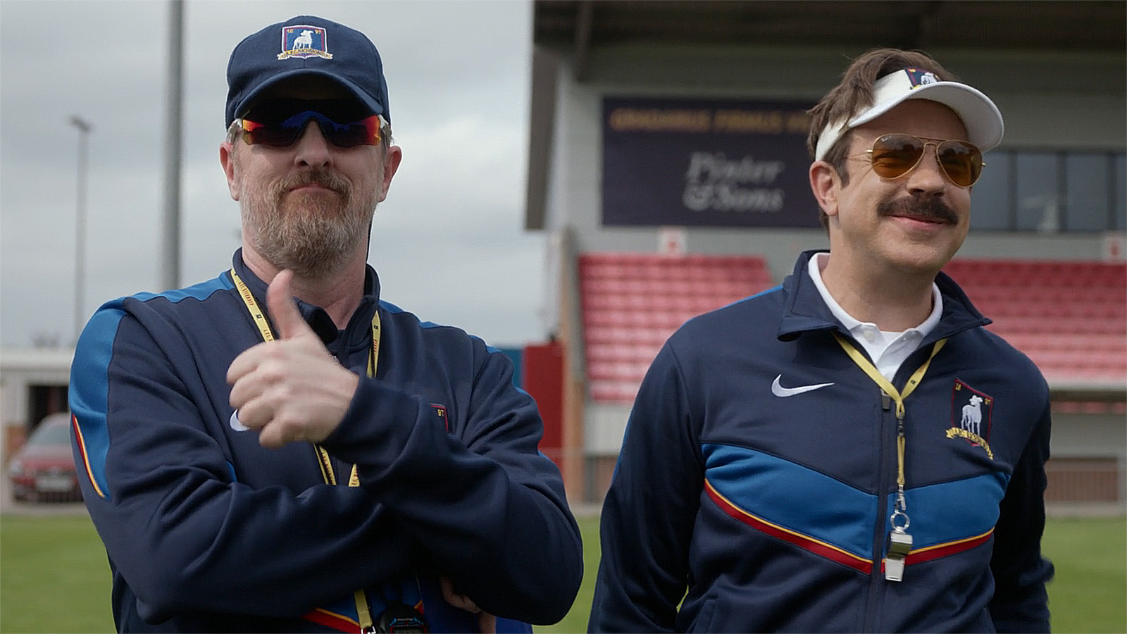 Coach Beard giving a thumbs up as he stands next to Ted in Ted Lasso season 4 episode 3