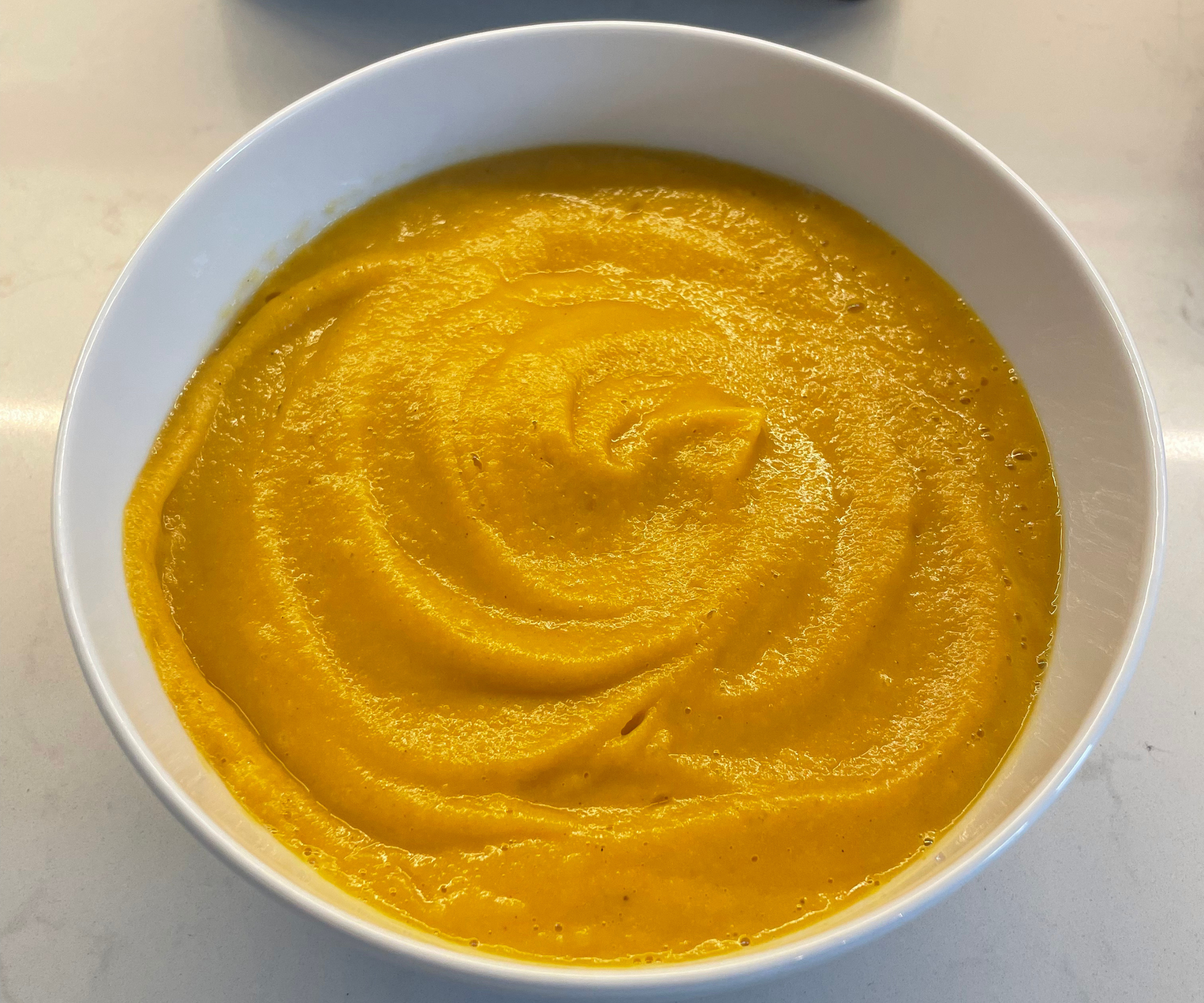 A smooth sweet potato soup, made in the Vitamix A3500