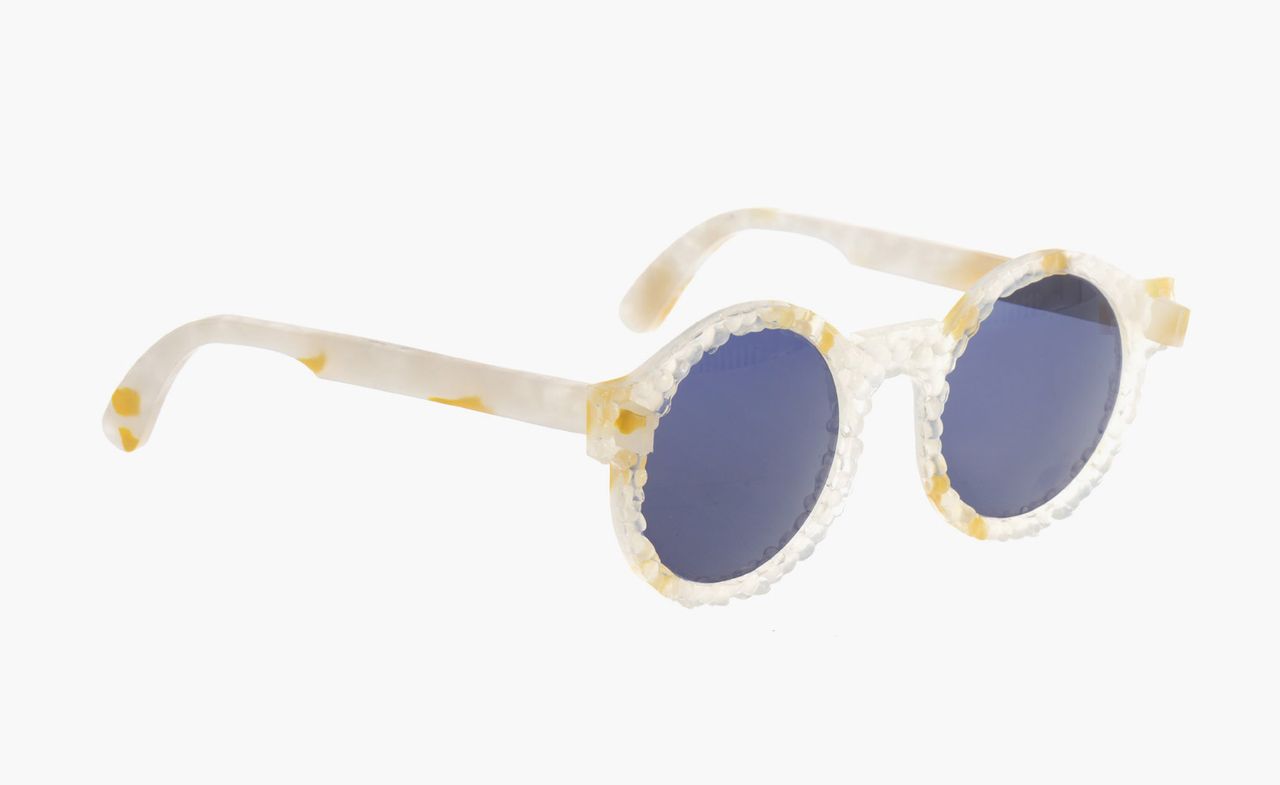 Blue lens glasses with white and orange textured frame