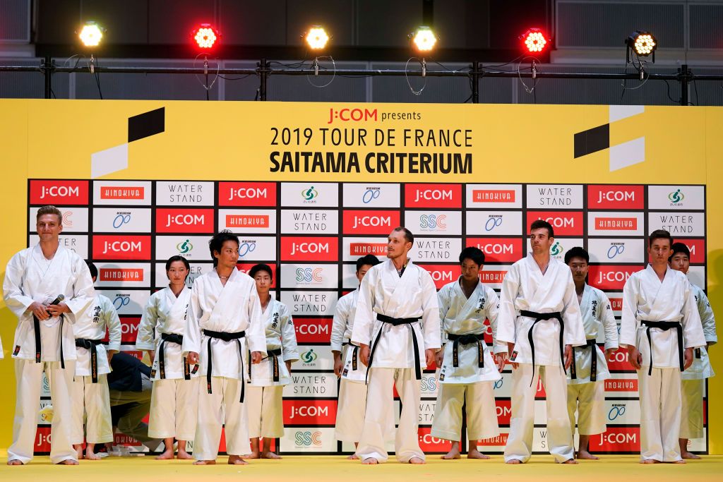 Riders do karate and football-darts before the 2019 Saitama Tour de France criterium