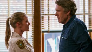Katee Sackhoff and Robert Taylor having a conversation at the sheriff's office in Longmire.