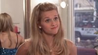 Elle smiling while shopping in Legally Blonde.