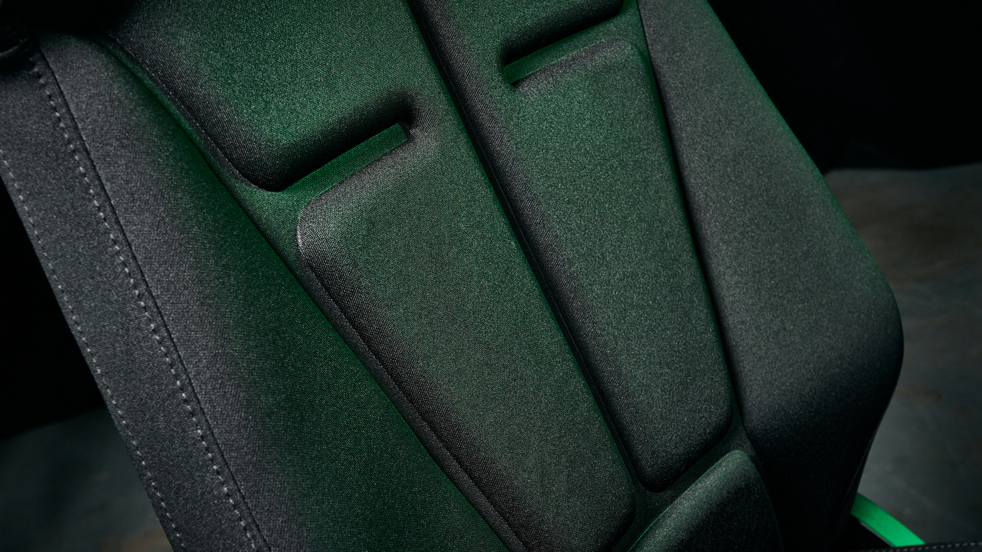 The Razer Soma Chroma back rest padding and lumbar curve, illuminated with a green glow