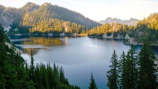 Scenic views from the Snow Lake trail in Washington's Cascade Mountains showing trees, peaks and an alpine lake