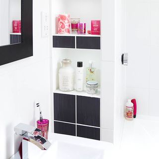 bathroom with white wall and lime green shower gel