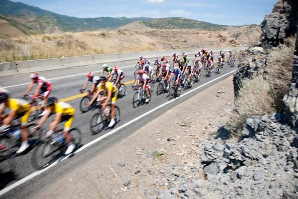 Riders pass along the highway.