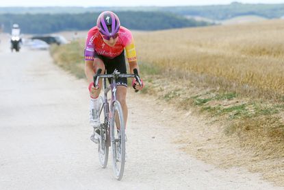 Marlen Reusser (SDWorx) rides over the Vitry Chemin Blanc sector on her way to winning stage four of the 2022 Tour de France Femmes