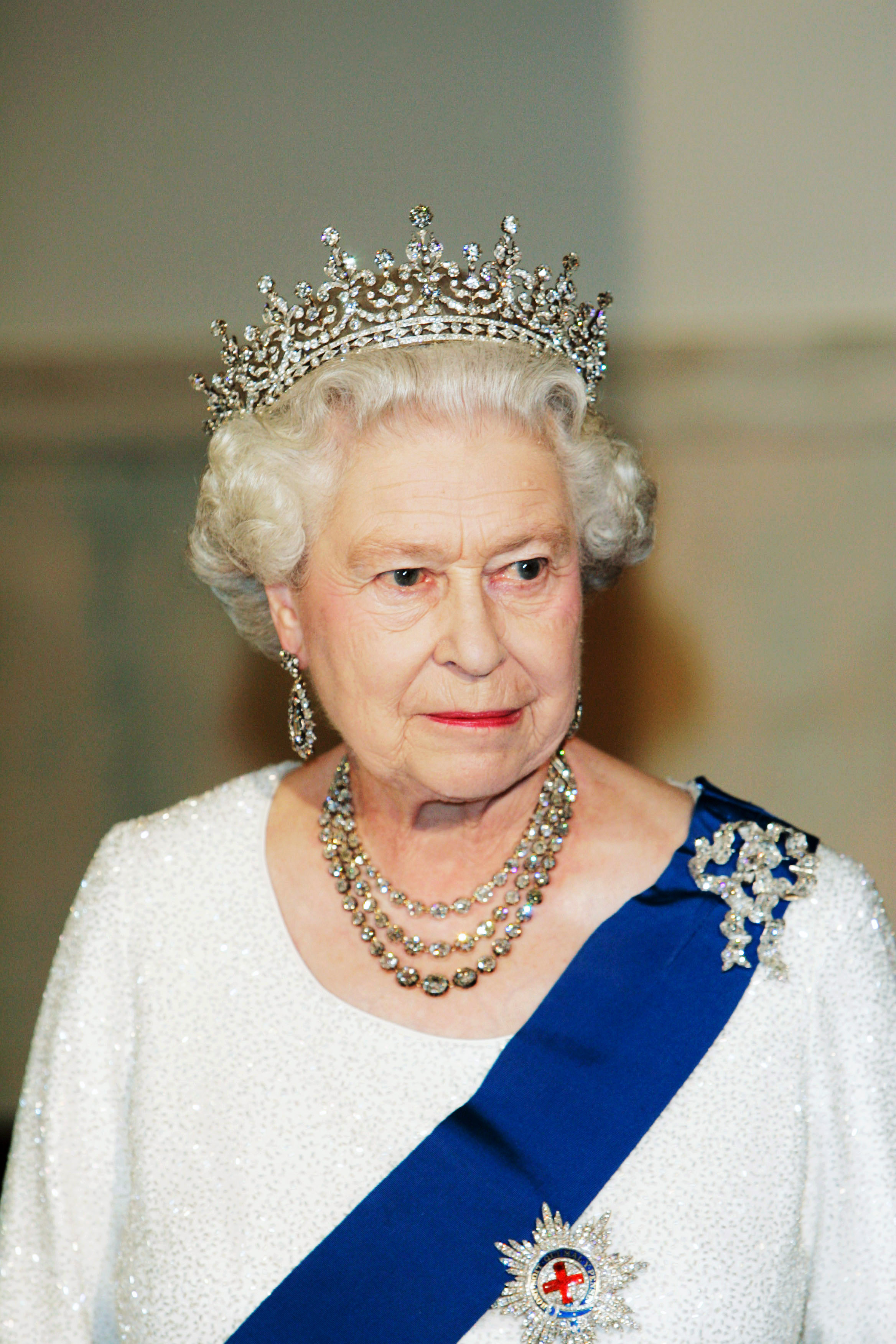 Queen Elizabeth wearing a tiara and white gown