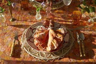 A fall inspired tablescape with orange and red scheme