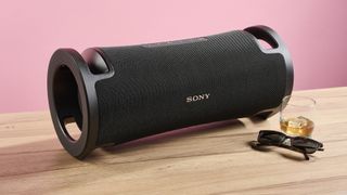 Sony ULT Field 7 speaker on a stone surface, with sunglasses next to it, showing it to be large