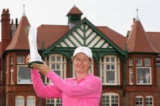 Catriona Matthew holds up the Ricoh Women's British Open trophy in 2009