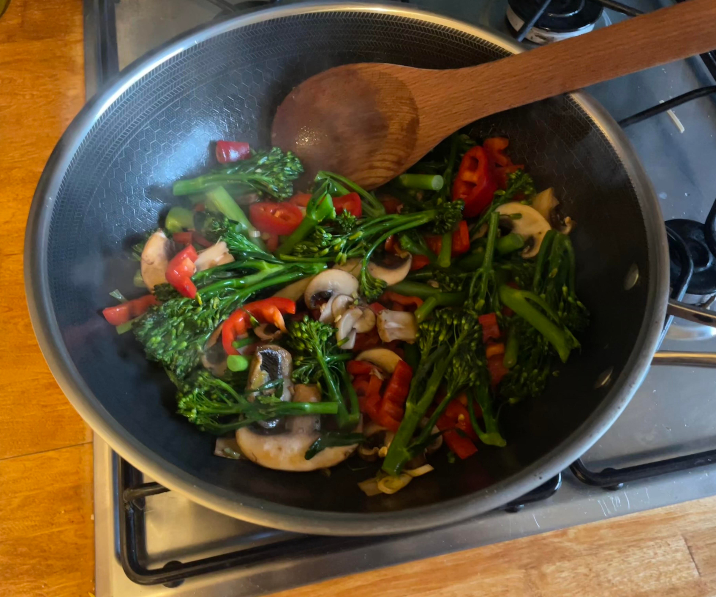 Stir-frying vegetables in the HexClad wok