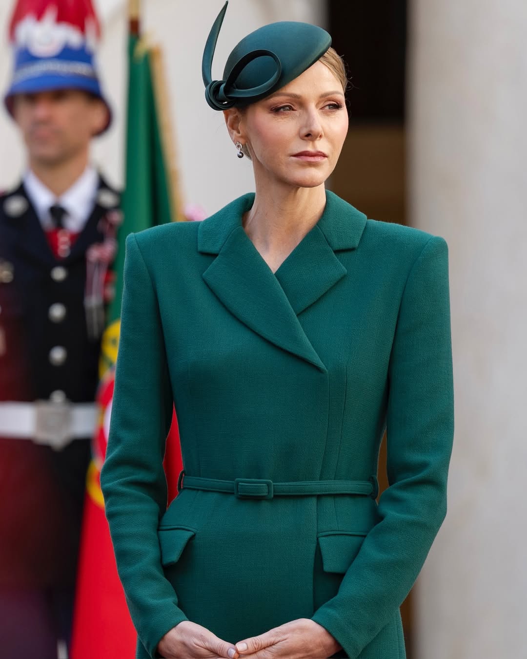 Princess Charlene wearing a green coat dress and matching hat