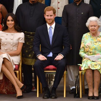 london, england june 26 meghan, duchess of sussex, prince harry, duke of sussex and queen elizabeth ii at the queens young leaders awards ceremony at buckingham palace on june 26, 2018 in london, england the queens young leaders programme, now in its fourth and final year, celebrates the achievements of young people from across the commonwealth working to improve the lives of people across a diverse range of issues including supporting people living with mental health problems, access to education, promoting gender equality, food scarcity and climate change photo by john stillwell wpa poolgetty images