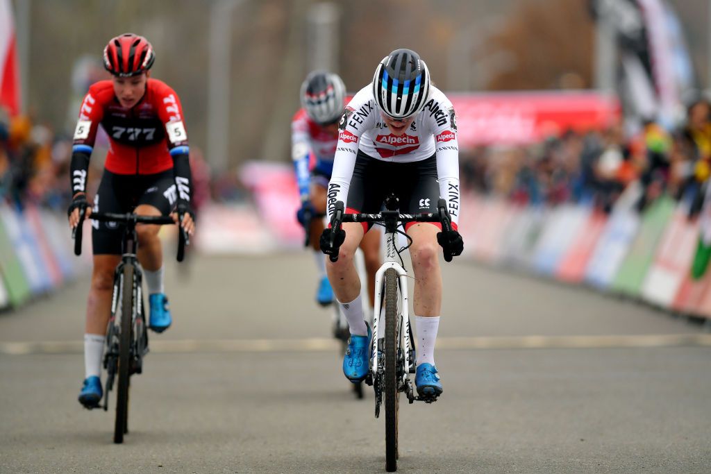 TABOR CZECH REPUBLIC NOVEMBER 14 Puck Pieterse of The Netherlands and Team AlpecinFenix reacts after cross the finishing line in second place ahead of Annemarie Worst of The Netherlands and Team 777 during the 25th Tabor UCI CycloCross Worldcup 2021 Womens Elite CXWorldCup on November 14 2021 in Tabor Czech Republic Photo by Luc ClaessenGetty Images