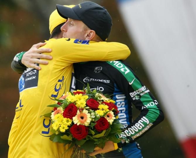 Teammates Alberto Contador and Levi Leipheimer (Discovery Channel) embrace after taking first and third in the 2007 Tour.