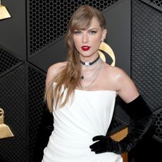 Taylor Swift poses at the 2024 Grammy Awards.