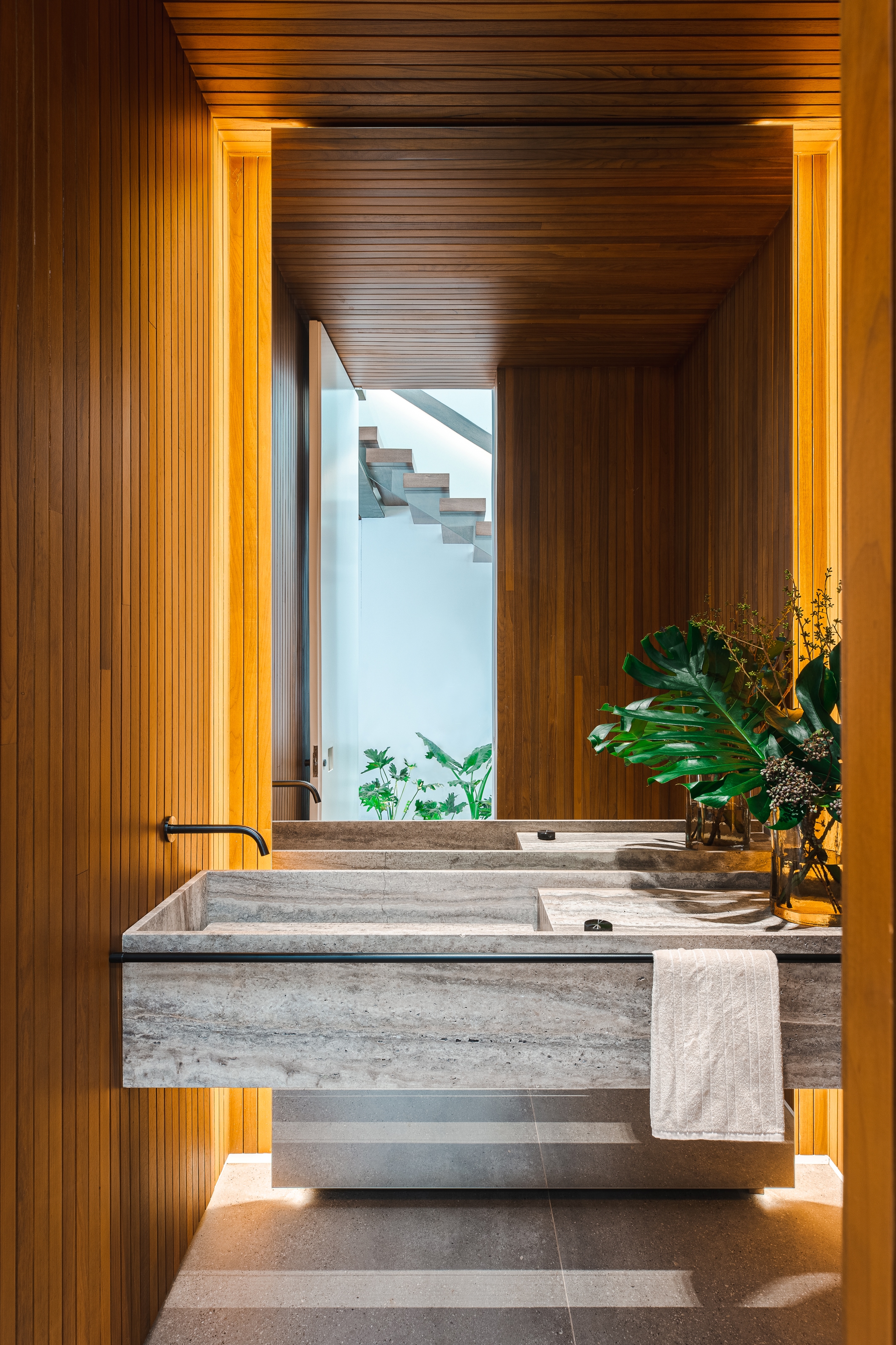 The ground floor bathroom is a wood-clad sanctuary