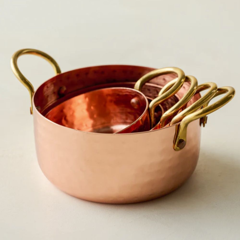 Copper measuring cups with brass handles