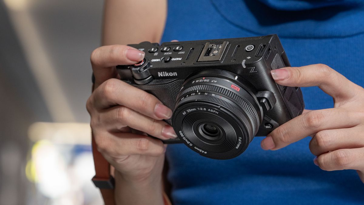 Viltrox AF 26mm F2.8 EVO lens attached to a Nikon camera in user's hands