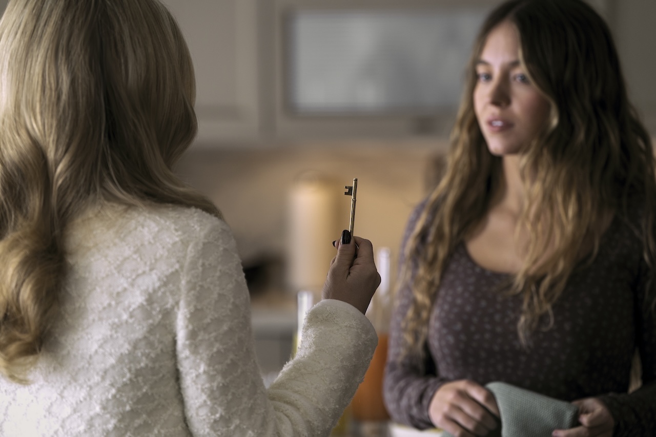 Sydney Sweeney looking at Amanda Seyfried in The Housemaid