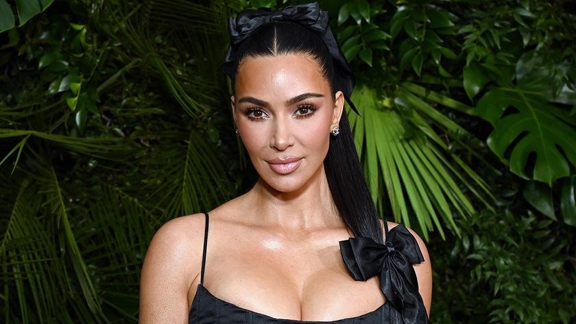 Kim Kardashian in little black dress and hair bow 2025 awards season event.